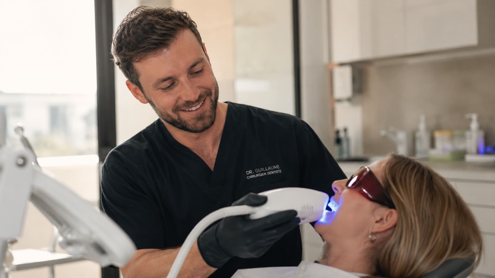 Dentist treating a patient in a bright modern clinic